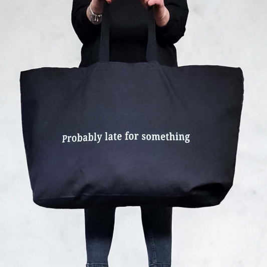 extra large black canvas tote bag with a custom text 'Probably late for something'