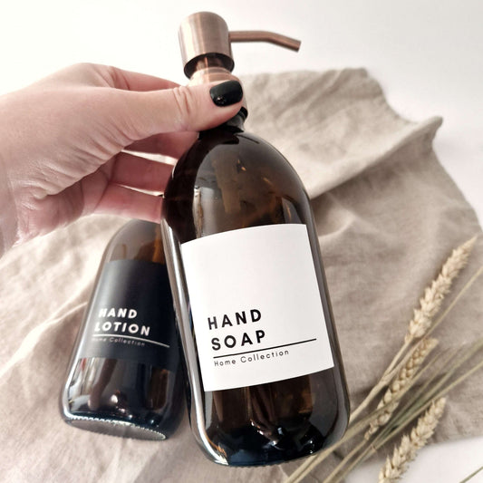 Minimalist waterproof label on amber soap bottle