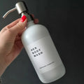 White waterproof label on matte shite refillable shampoo bottle. The label has a personalised text 'Her Body Wash' in bold and 'Bathroom Collection' underneath.