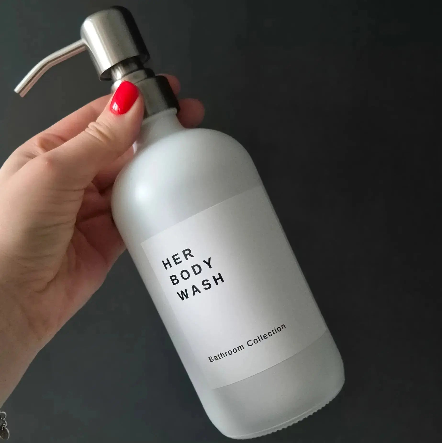 White waterproof label on matte shite refillable shampoo bottle. The label has a personalised text 'Her Body Wash' in bold and 'Bathroom Collection' underneath.
