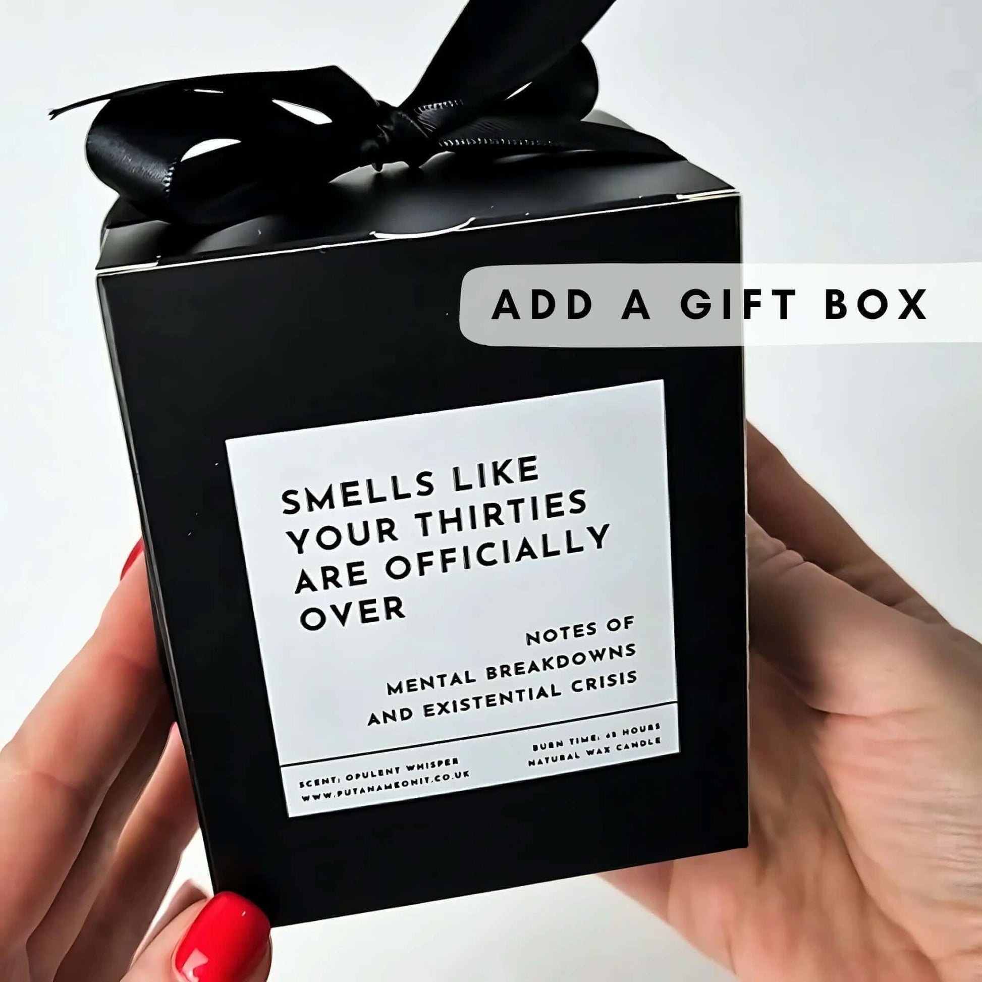 a personalised candle in a classy black gift box and a ribbon
