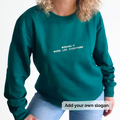 Green sweatshirt with text 'Winging it, Work, Life, Everything' on a white background