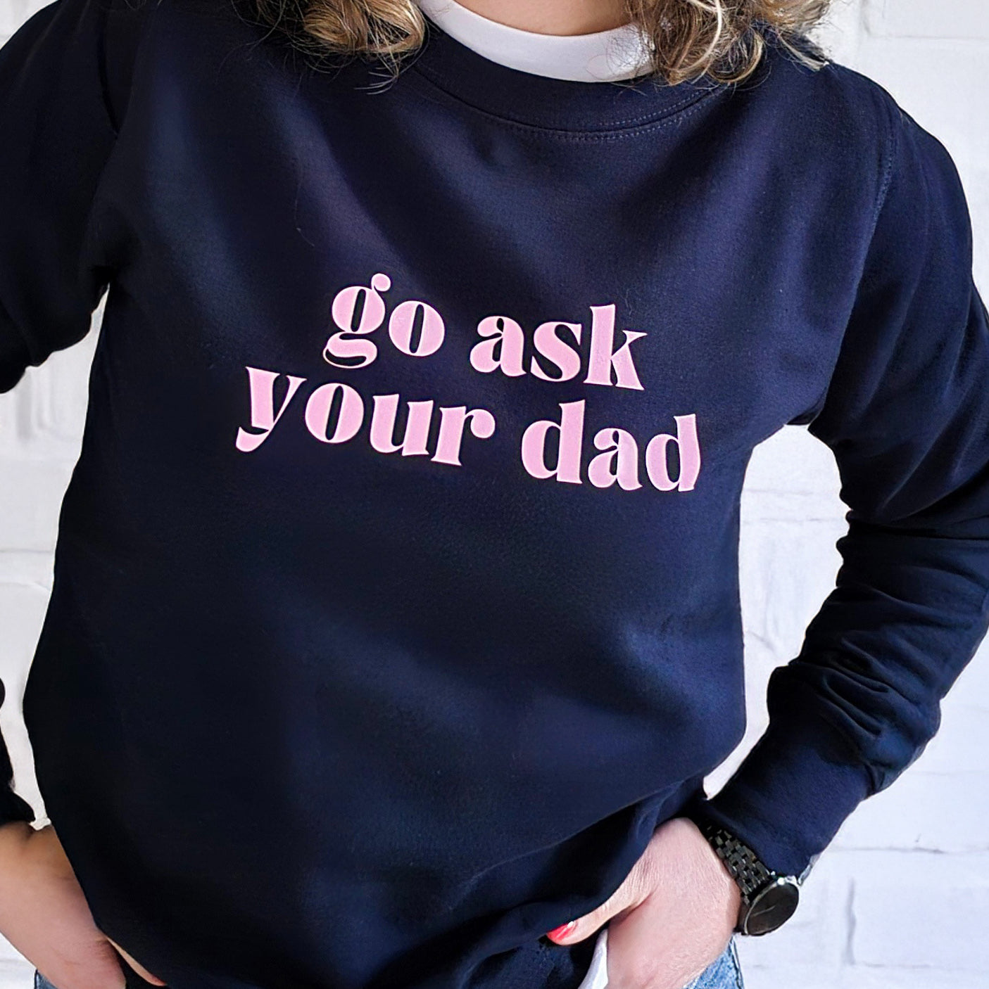 Mum wearing a cosy sweatshirt, holding a coffee cup
