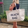 Extra Large Canvas tote bag  with a black text 'Beach Bag'