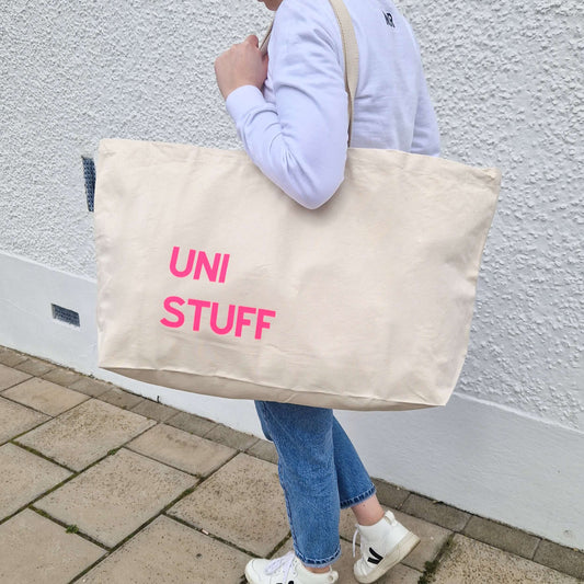 Extra-Large Natural colour Tote Bag with a neon pink text 'Uni Stuff'