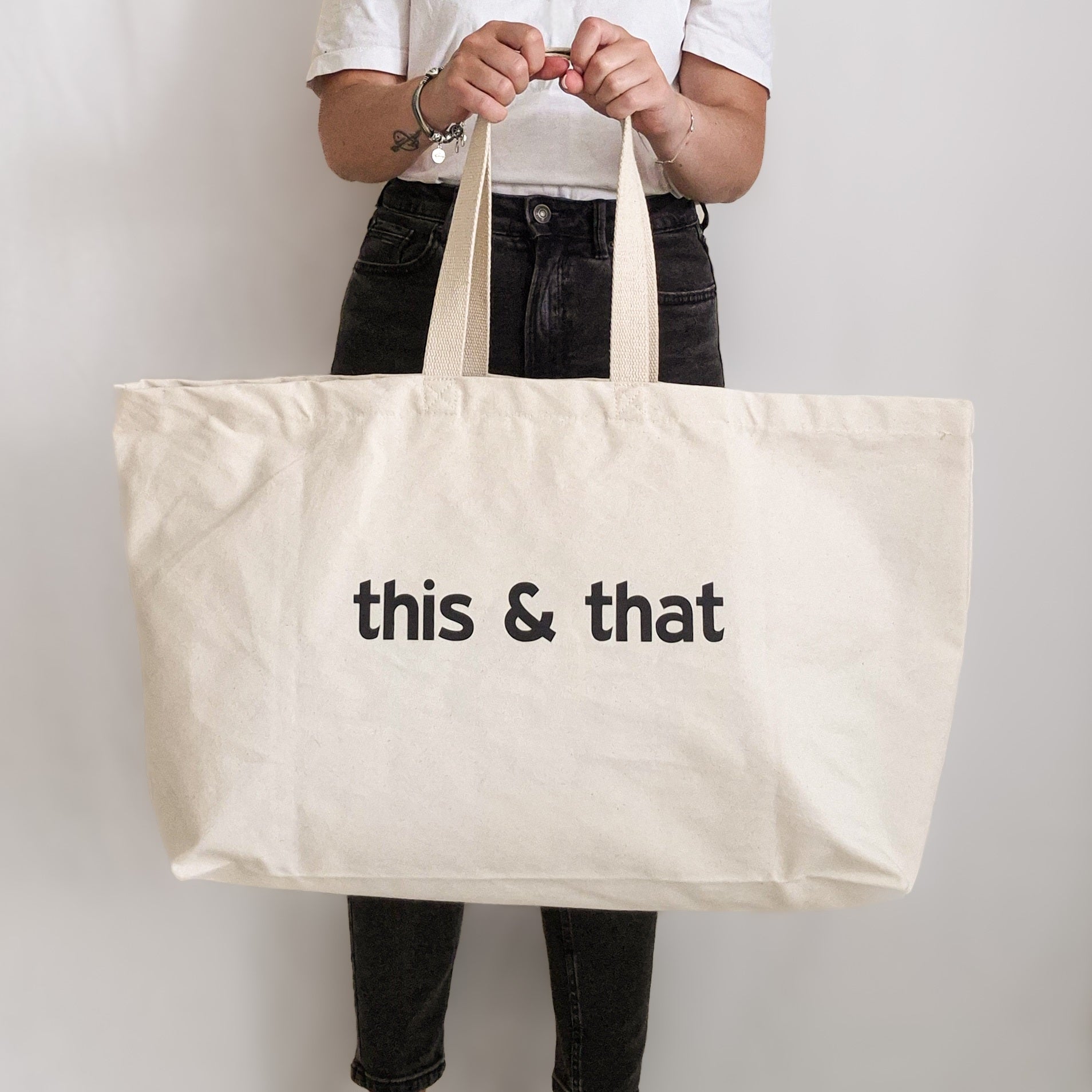 Large natural canvas personalised tote bag with editable black text, perfect for shopping or travel