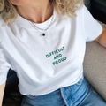 Person wearing a white t-shirt with 'DIFFICULT AND PROUD' text in green.