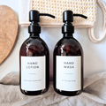 Two brown bottles labeled 'Hand Lotion' and 'Hand Wash' on a neutral background.