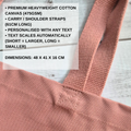 A close-up of a dusty rose pink canvas tote bag strap with a text overlay detailing product specifications and dimensions.
